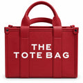 Red leather tote with graphic text print