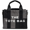 Denim patchwork tote with graphic text print