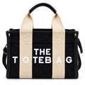 Black canvas tote with graphic text print